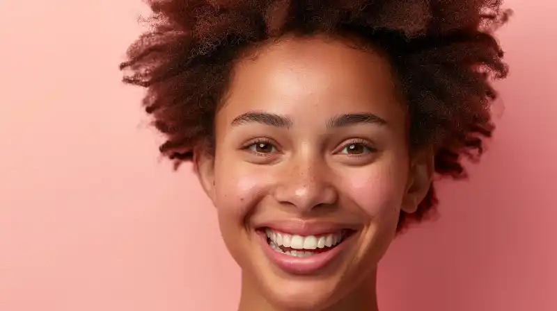 A confident person showcasing a dental implant with a bright smile.