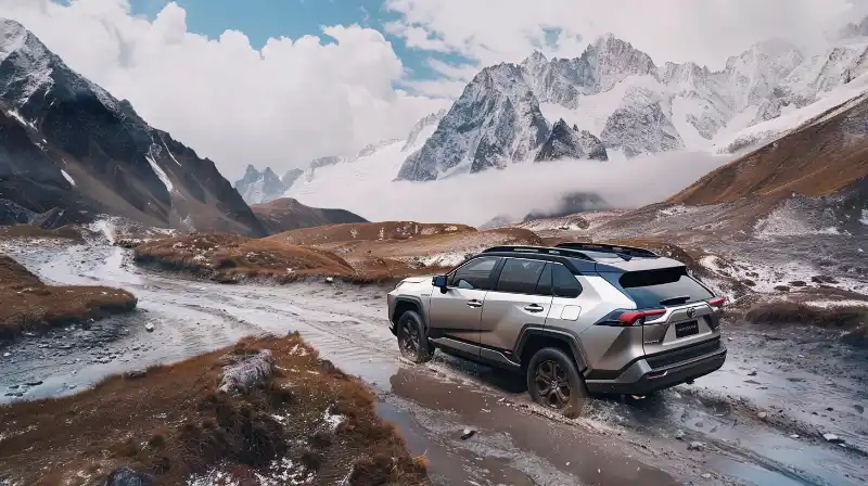 The 2024 Toyota RAV4 showcased in a rugged mountain landscape.