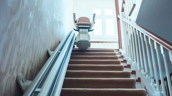 stairlift at the top of a home stair